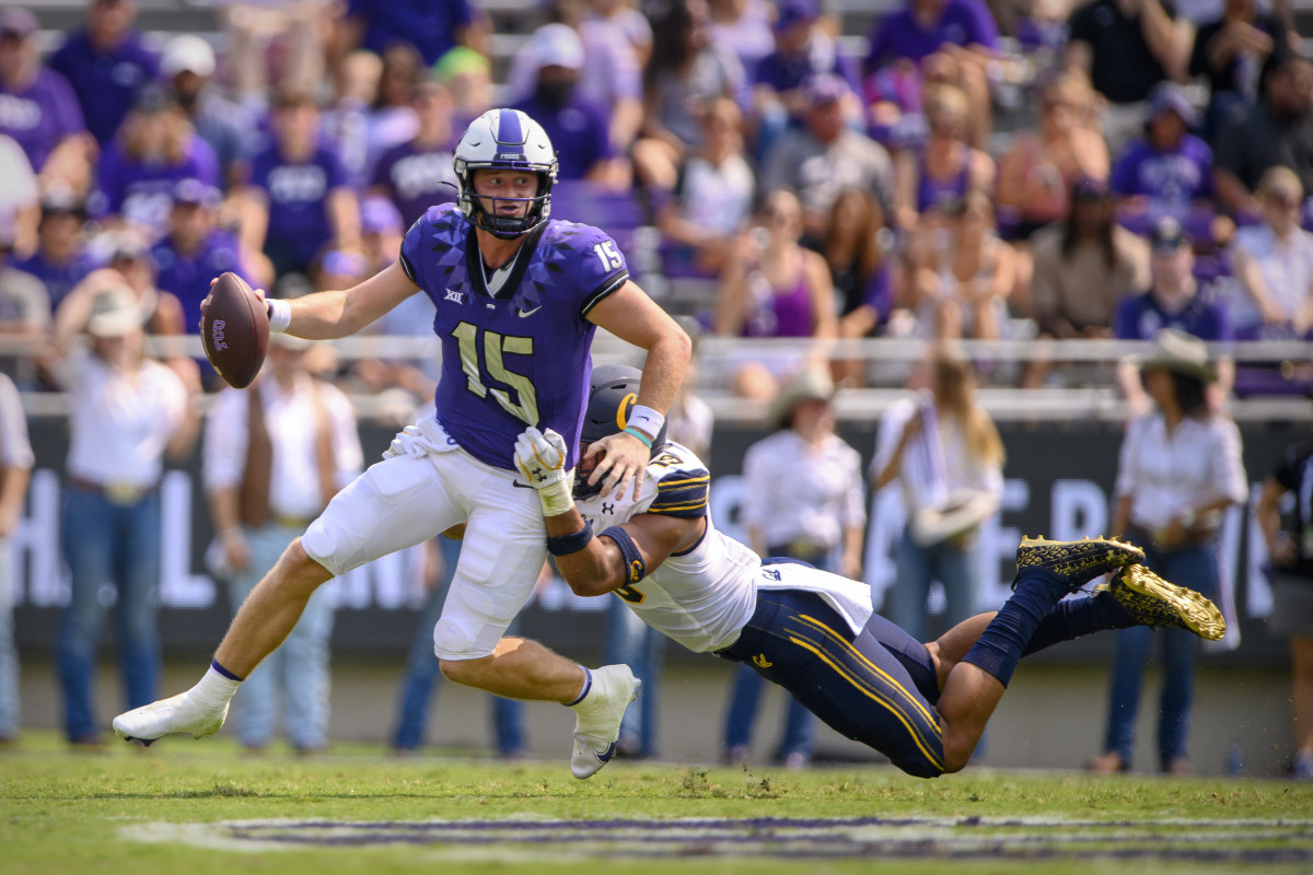 Cameron Goode (19) stretches out to tackle TCU quarterback Max Duggan (15).